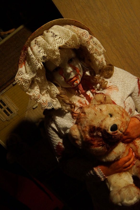 Creepy girl with teddy bear